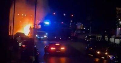 Residents hear 'big explosion' before car bursts into flames - www.manchestereveningnews.co.uk - Manchester