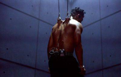 Watch Miguel perform while suspended from hooks pierced in his skin - www.nme.com - Los Angeles - Los Angeles