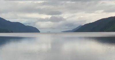 Couple 'filmed Loch Ness Monster' on morning swim after cancelling holiday to hunt creature - www.dailyrecord.co.uk - Scotland - Beyond