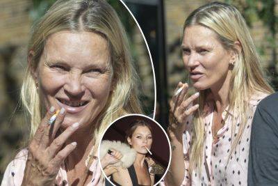 Kate Moss looks unrecognizable while smoking a cigarette during lunch outing - nypost.com - New York - Hollywood - London