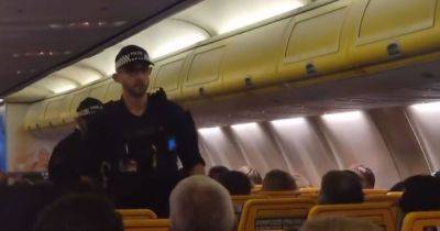 Police storm Ryanair flight forced to return to Manchester Airport after 'mid-air fight' erupts with man arrested - www.manchestereveningnews.co.uk - Manchester - Portugal