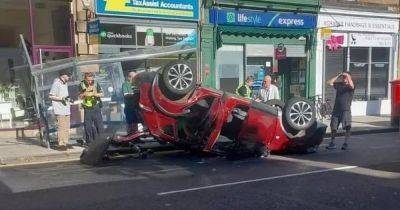 Car flips into bus stop after horror crash in Edinburgh - www.dailyrecord.co.uk - Scotland - Beyond