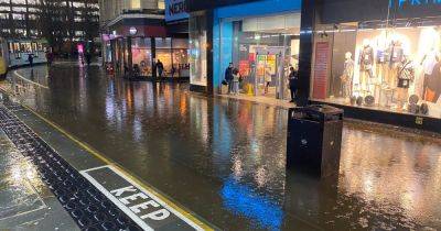 'Welcome to Lake Primark': Heavy rain creates huge 'Market Street Canal' as shoppers dodge flooded streets - www.manchestereveningnews.co.uk - Britain - Manchester