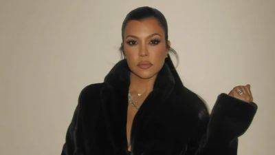 Kourtney Kardashian Barker and Baby Rocky Found ‘Blisssss’ in Matching Versace Robes - www.glamour.com