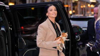 Demi Moore Posing in White Go-Go Boots With a Tiny Dog Is an Eternal Vibe - www.glamour.com - Manhattan