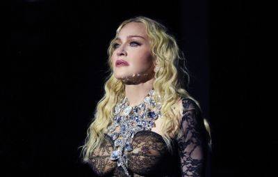 Fans defend Madonna after “ageist” trolls incorrectly mock her for using support beam at show - www.nme.com - London - USA