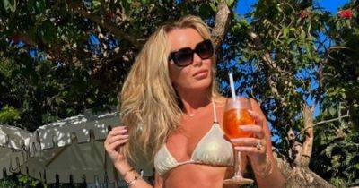 Amanda Holden, 52, branded 'incredible' as she shows off stunning abs in tiny bikini - www.ok.co.uk - city Cape Town