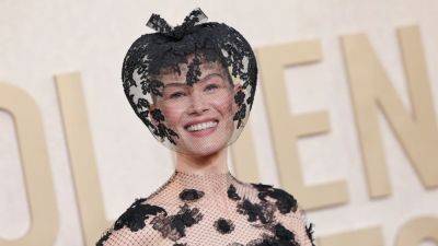 Why Did Rosamund Pike Wear a Black Veil to the 2024 Golden Globes? - www.glamour.com - Hollywood - Italy