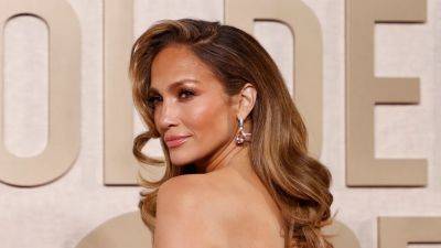 This Is Jennifer Lopez...With Heavy Shag Bangs - www.glamour.com