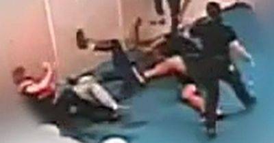'Sickening' mass brawl in prison caught on camera as two young offenders attack guard - www.dailyrecord.co.uk