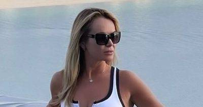 Amanda Holden, 53, is sensational in white bikini as she soaks up the sun with her daughters - www.ok.co.uk - Britain - Dubai
