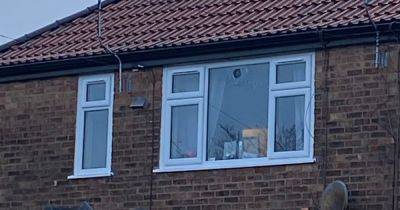 'Bullet hole' seen in window after gunshots blasted at house as neighbours hear 'four bangs' - www.manchestereveningnews.co.uk - Manchester - county Garden