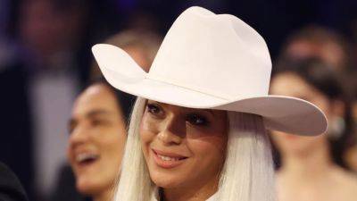 Beyoncé Snuck Into the 2024 Grammys in an Unsubtle White Hat and Bedazzled Leather Shorts Suit - www.glamour.com