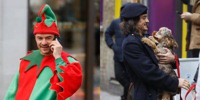 Orlando Bloom Channels a Christmas Elf, Cuddles With a Puppy on Set of 'Deep Cover' - www.justjared.com - London - county Howard - county Dallas