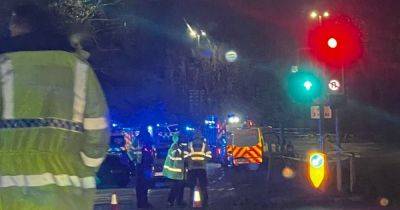 Huge emergency services presence and police helicopter after 'serious' crash closes main road - www.manchestereveningnews.co.uk - Manchester