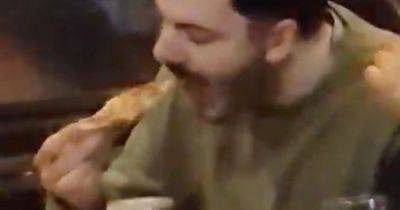 'Criminal' video of man dipping Domino's pizza into Guinness horrifies internet - www.dailyrecord.co.uk - London - county Kings