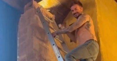 Victoria Beckham thrills fans with topless video of husband David completing some DIY - www.ok.co.uk