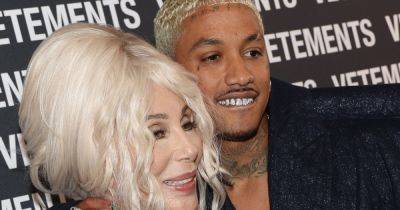 Cher shows off bleach blonde hair as she cosies up to boyfriend, 38, at Paris Fashion Week - www.ok.co.uk - Hollywood