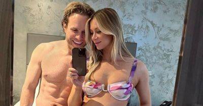 Olly Murs' pregnant wife displays bare bump in bikini snap as she counts down to baby's arrival - www.ok.co.uk