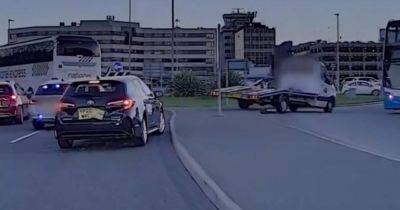 Dramatic footage shows moment police chase ends at Manchester Airport as driver goes wrong way round roundabout and smashes through barrier - www.manchestereveningnews.co.uk - Manchester