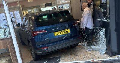 Dramatic pictures show moment 75-year-old woman ploughs car through front of jewellers - www.manchestereveningnews.co.uk - Manchester