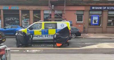 Man rushed to hospital after 'fight' on Glasgow street as police probe incident - www.dailyrecord.co.uk - Scotland