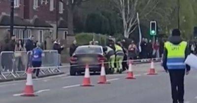 Stewards try to stop 'disgruntled resident' driving down street 'almost hitting runners' during Manchester Marathon - www.manchestereveningnews.co.uk - county Marathon - city Manchester, county Marathon - Adidas