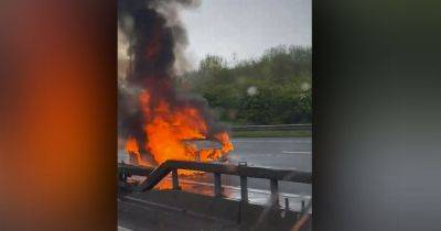Woman seriously injured after falling from M60 bridge before car fire causes delays - www.manchestereveningnews.co.uk - Manchester