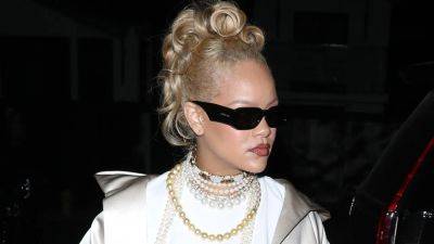 Rihanna Disproved the ‘Less Is More’ Fallacy With a Baggy 'Fit and Curly Blonde Updo - www.glamour.com - Los Angeles - California