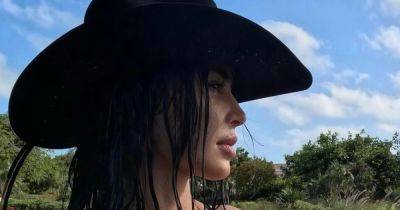 Kim Kardashian sends fans wild with sultry bikini and cowboy hat pics on holiday with sister Khloe - www.ok.co.uk - Texas - Chicago - Turks And Caicos Islands