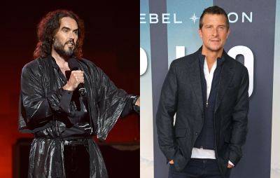 Russell Brand embraces Bear Grylls as he shares photo from River Thames baptism - www.nme.com