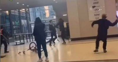 Manchester Arndale brawl caught on camera as cackling youths hurl objects and trade blows - www.manchestereveningnews.co.uk - Manchester