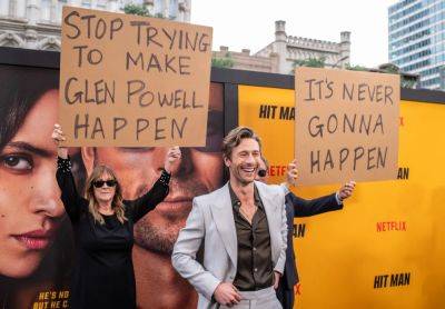 Glen Powell’s Parents Showed Up on His Red Carpet With Signs Trolling Him: ‘Stop Trying to Make Glen Powell Happen’ and ‘It’s Never Gonna Happen’ - variety.com - New York - Texas - Houston - county Maverick