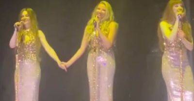 Cheryl and Nadine Coyle share sweet onstage moment as emotional stars hold hands after Sarah Harding tribute - www.ok.co.uk - Dublin