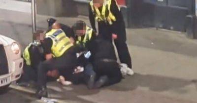 Police investigating social media video appearing to show officer 'elbowing' man as he's held down - www.manchestereveningnews.co.uk - Manchester