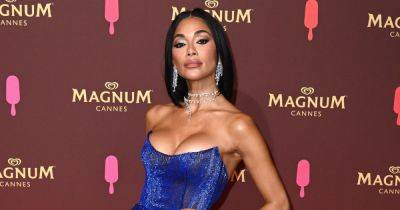 Nicole Scherzinger fans say 'it's illegal to be this hot' as she dances in racy cut-out swimsuit - www.ok.co.uk