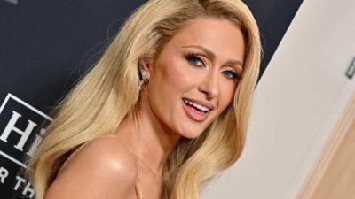 Paris Hilton Is Already Teaching Her 6-Month-Old Daughter How to Say ‘That’s Hot' - www.glamour.com