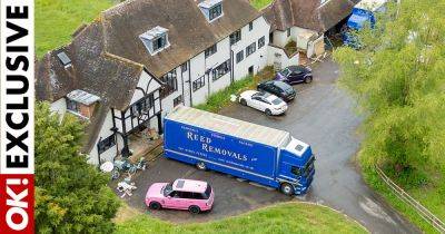 Katie Price's Mucky Mansion swarmed by removal trucks as she flees after ‘acid attack’ - www.ok.co.uk