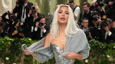 Did Kim Kardashian's Met Gala Sweater Have Something to Do With Taylor Swift? - www.glamour.com