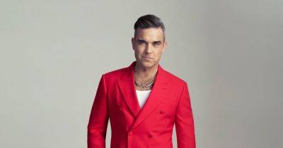 Robbie Williams branded 'unrecognisable' as fans go wild for star's new look - www.ok.co.uk - Britain - Chelsea - Cambodia