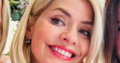 Holly Willoughby beams in rare snap with pals after being defended over 'rough ride' - www.manchestereveningnews.co.uk - Britain