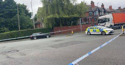 Major road shut off with 'taxi driver taken to hospital' after crash - www.manchestereveningnews.co.uk - Britain - Manchester