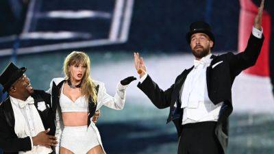 Taylor Swift Fans Are Unpacking the ‘Poetic’ Symbolism of Travis Kelce's Surprise Eras Tour Performance - www.glamour.com - Britain - London - USA - city Charlotte