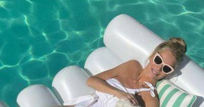 Tess Daly sends fans wild with addition to lounging pool snap amid 'Hollywood movie' remarks - www.manchestereveningnews.co.uk