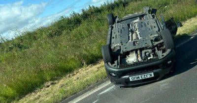 Man rushed to hospital after car flips onto roof on busy Scots road - www.dailyrecord.co.uk - Scotland