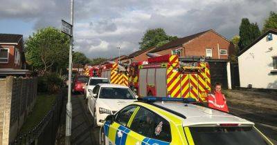 Police 'smashed door down' amid fears people were inside as house fire causes street to be evacuated - www.manchestereveningnews.co.uk - Manchester