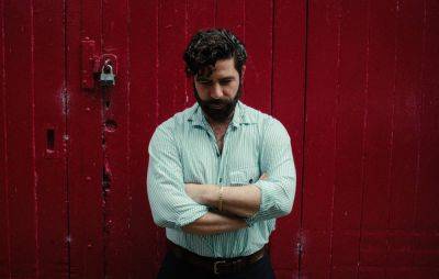Check out Foals’ Yannis Philippakis’ political new single ‘Under The Strikes’, featuring Tony Allen - www.nme.com - city Lagos