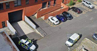 Man left with serious injuries after suspected stabbing outside apartment block - www.manchestereveningnews.co.uk - Manchester
